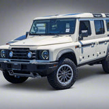Beige SUV with large wheels on a paved surface.