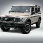 Beige Land Rover Defender in a parking lot with other vehicles.