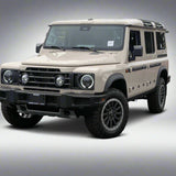 Beige Land Rover Defender in a parking lot with other vehicles.